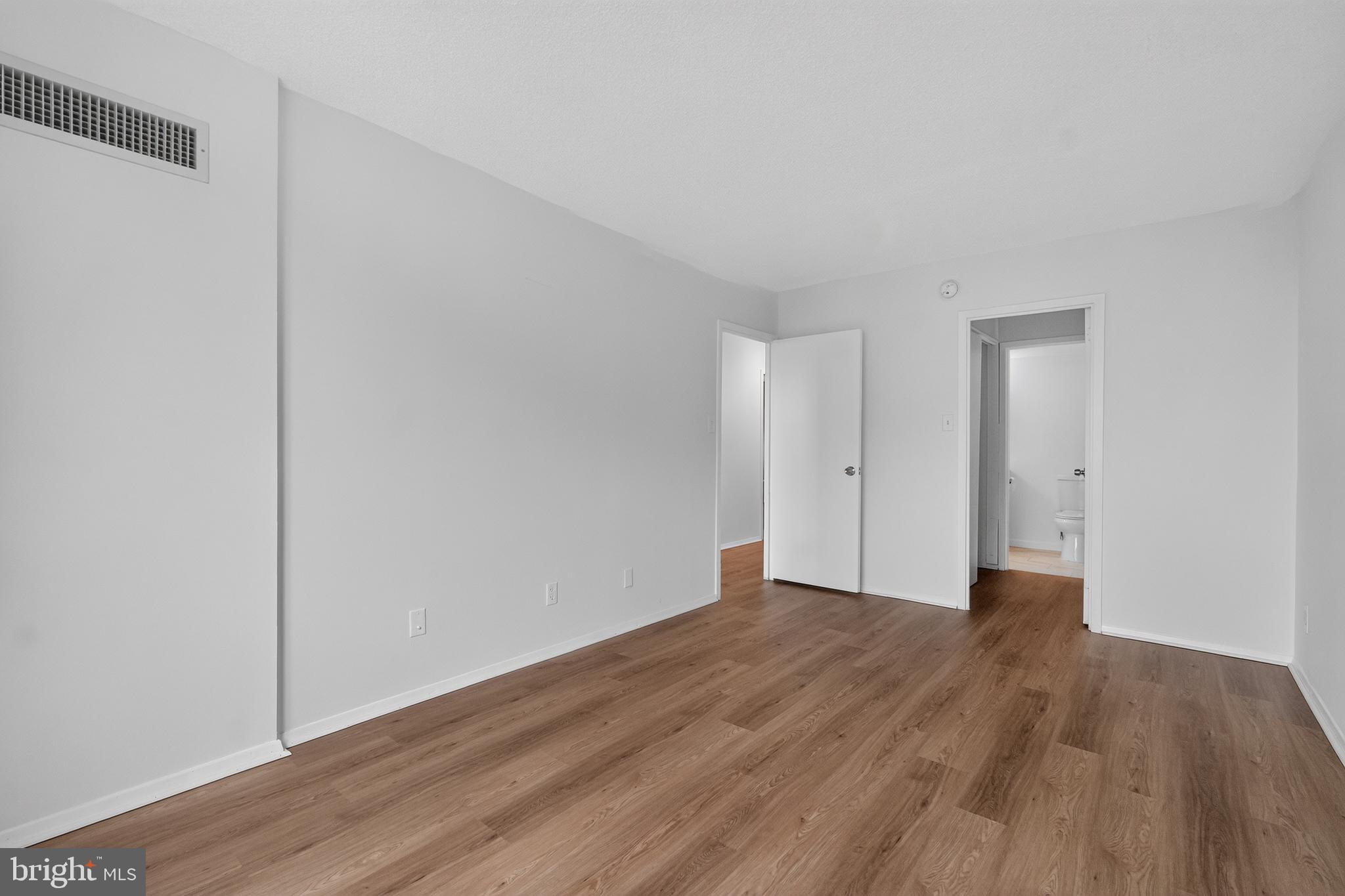 5225 Pooks Hill Road, Unit 1302N Bethesda, MD 20814 - Photo 15 of 19 a view of an empty room with wooden floor