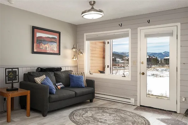 a living room with furniture and a large window