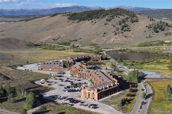an aerial view of a house with a lake view