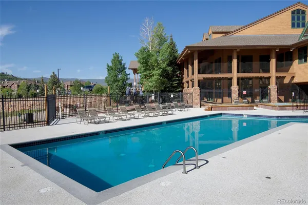 a view of a backyard with sitting area