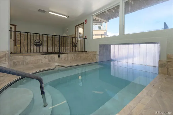 a view of a swimming pool with a lounge chairs