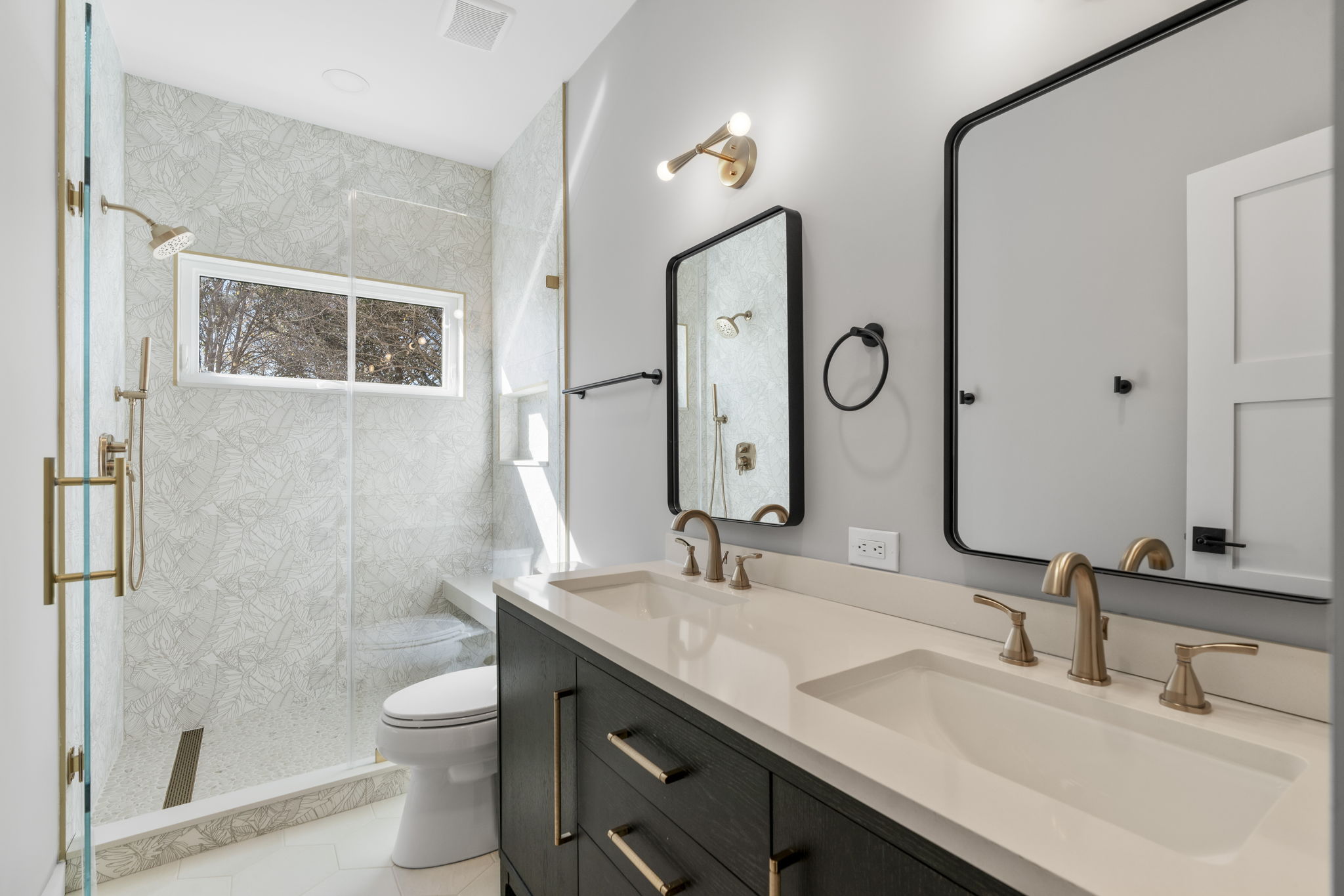 701 Furlong Drive Austin, TX 78746 - Photo 28 of 40 a bathroom with a granite countertop sink a toilet and a mirror