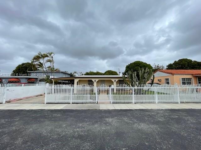 261 East 37th Street Hialeah, FL 33013 - Photo 1 of 13 front view of house with a street