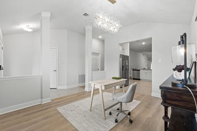 a kitchen with sink a stove and cabinets