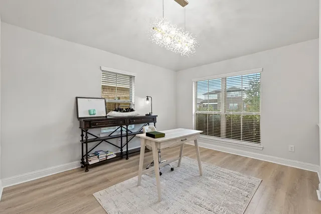 a view of a house with backyard sitting area and garden
