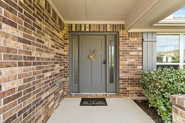 a view of a door and wooden floor