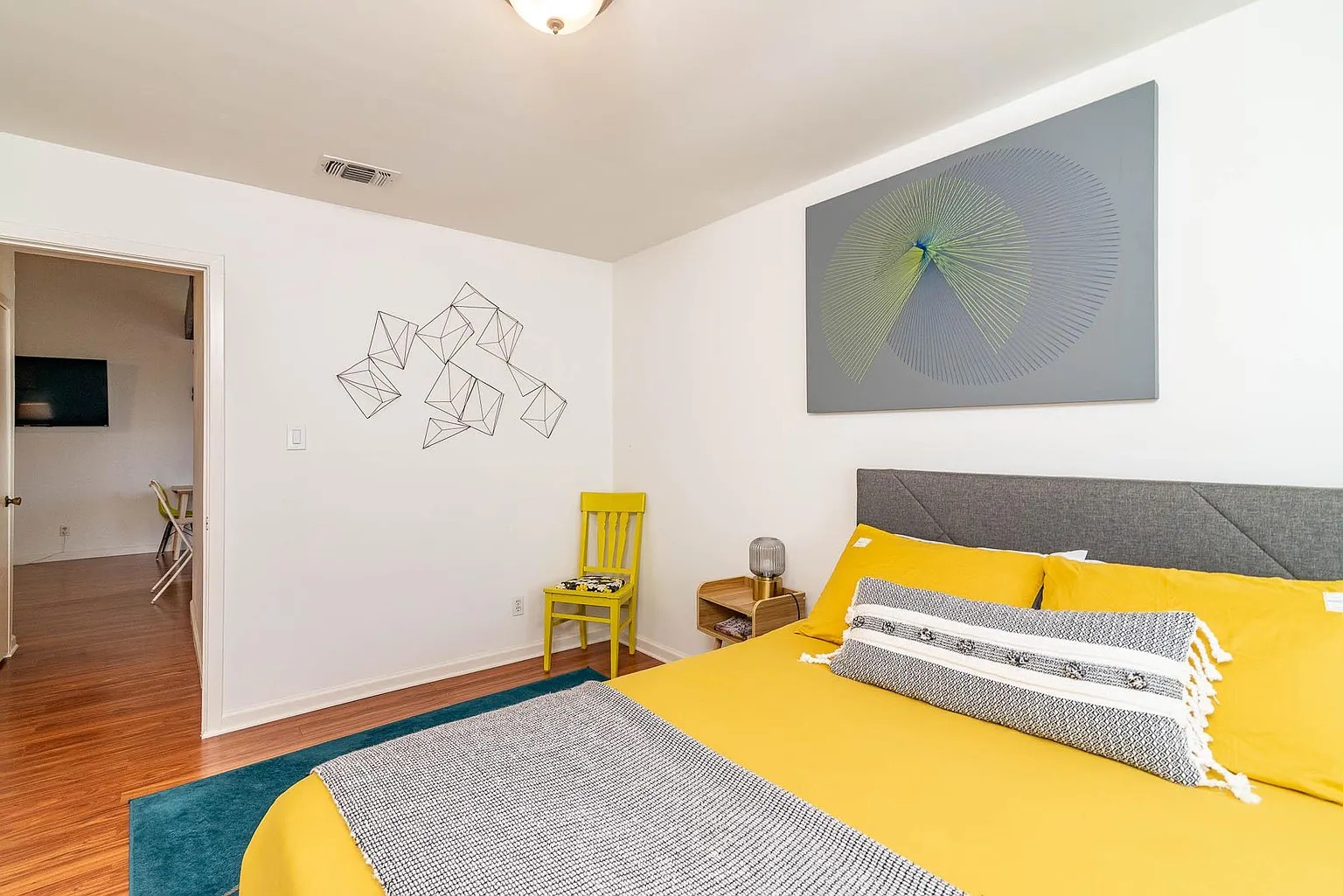 5405 Brompton Circle, Unit B Austin, TX 78745 - Photo 10 of 19 Bedroom with wood finished floors and baseboards