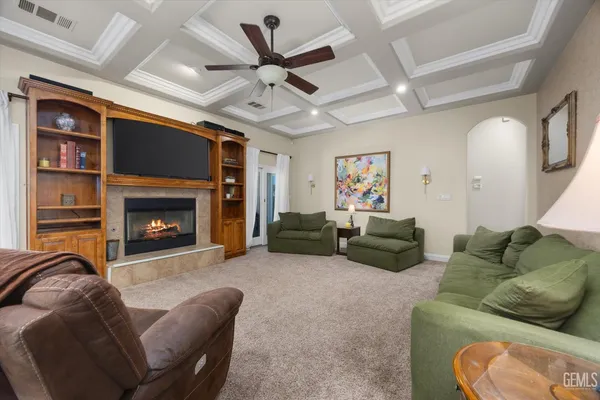 a bedroom with furniture and a chandelier