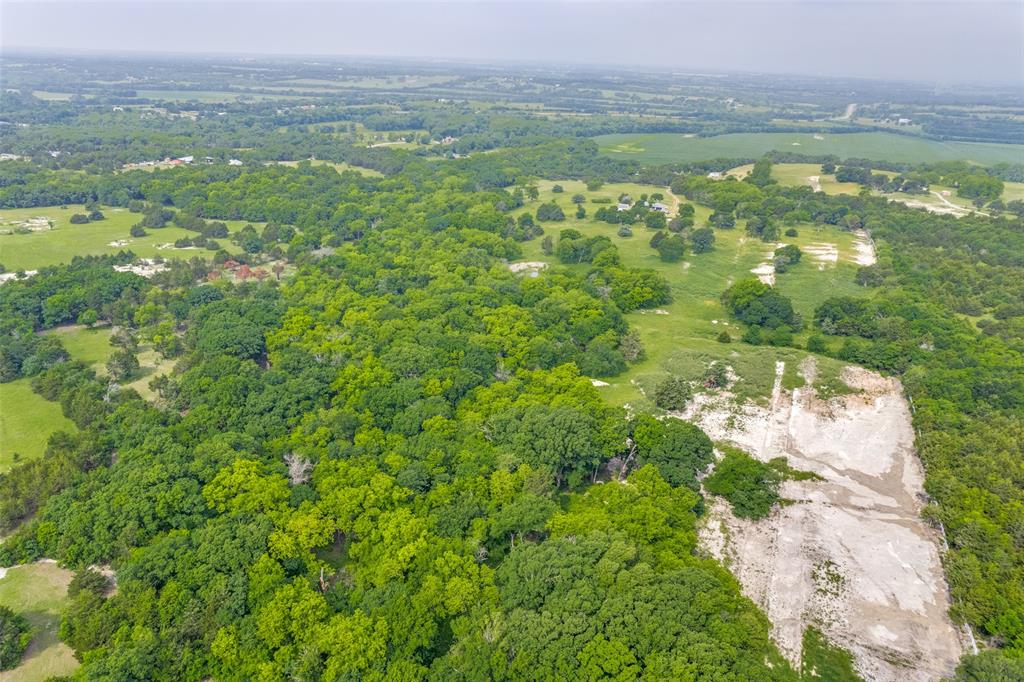 738 Campground Road Sherman, TX 75090 - Photo 8 of 40 a view of a lake with a field