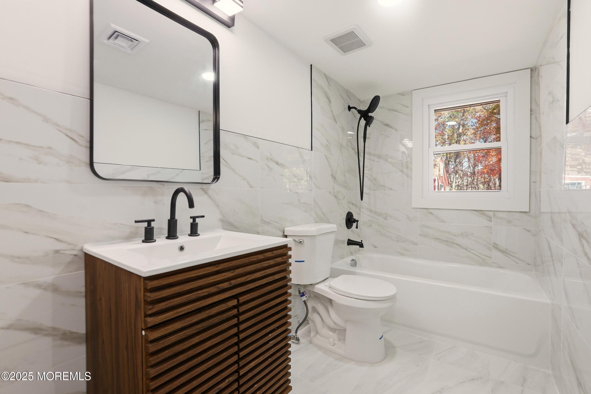 31 Rappleyea Court Howell, NJ 07731 - Photo 15 of 30 a bathroom with a sink a toilet and shower