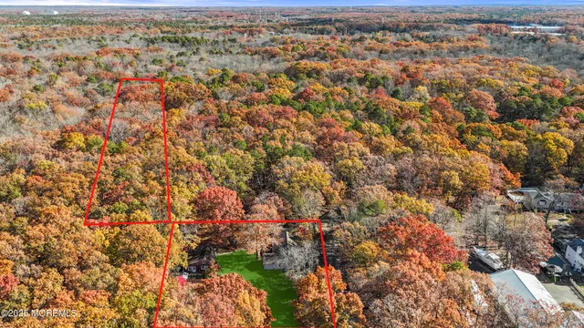 a view of house with yard