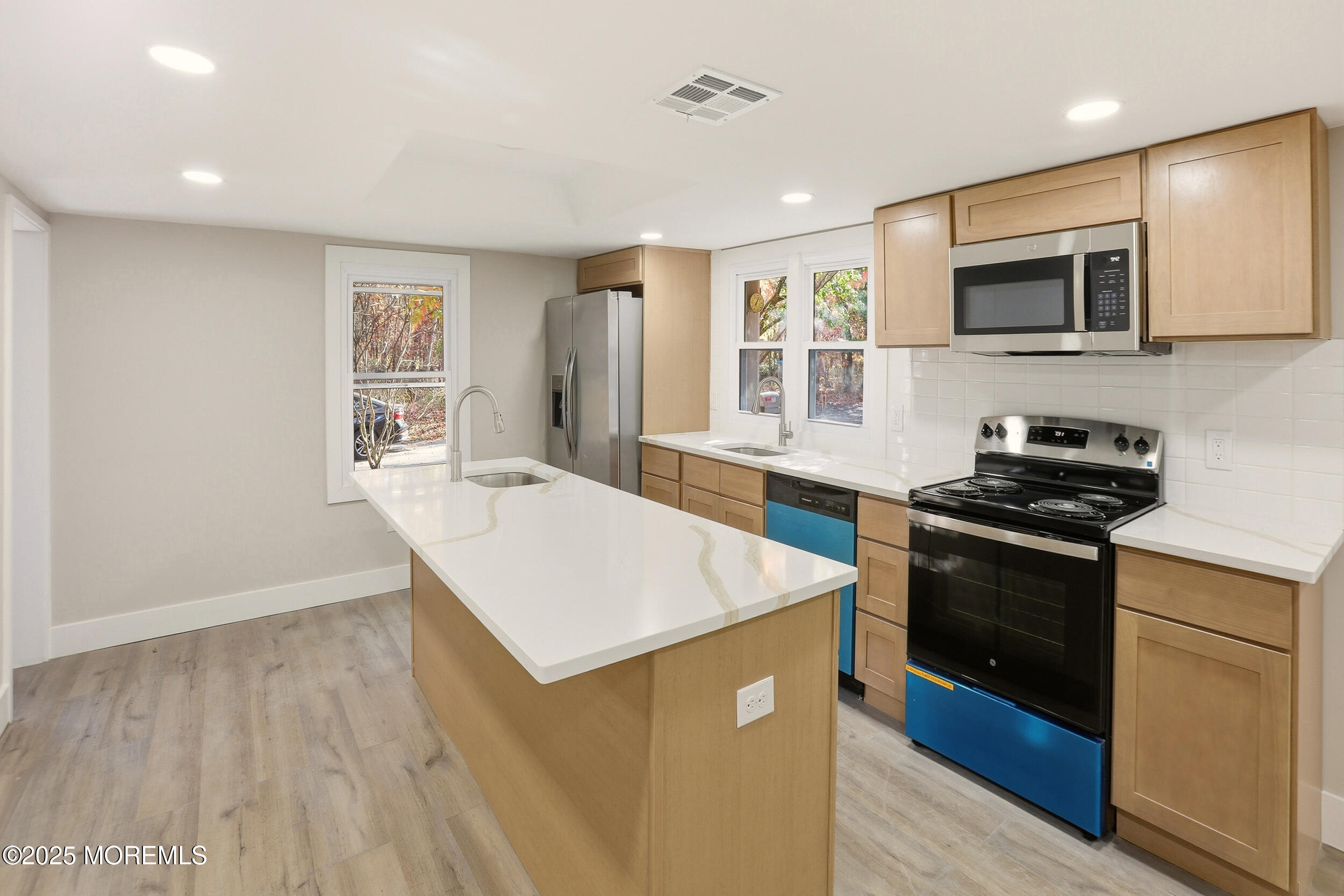 31 Rappleyea Court Howell, NJ 07731 - Photo 5 of 30 a kitchen that has a sink and a stove top oven