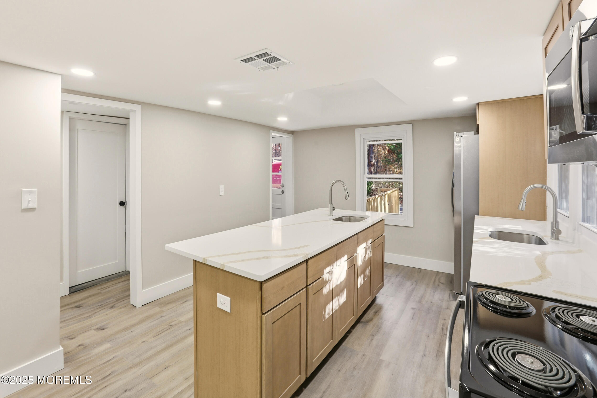31 Rappleyea Court Howell, NJ 07731 - Photo 7 of 30 a kitchen with stainless steel appliances granite countertop a sink a stove and a refrigerator