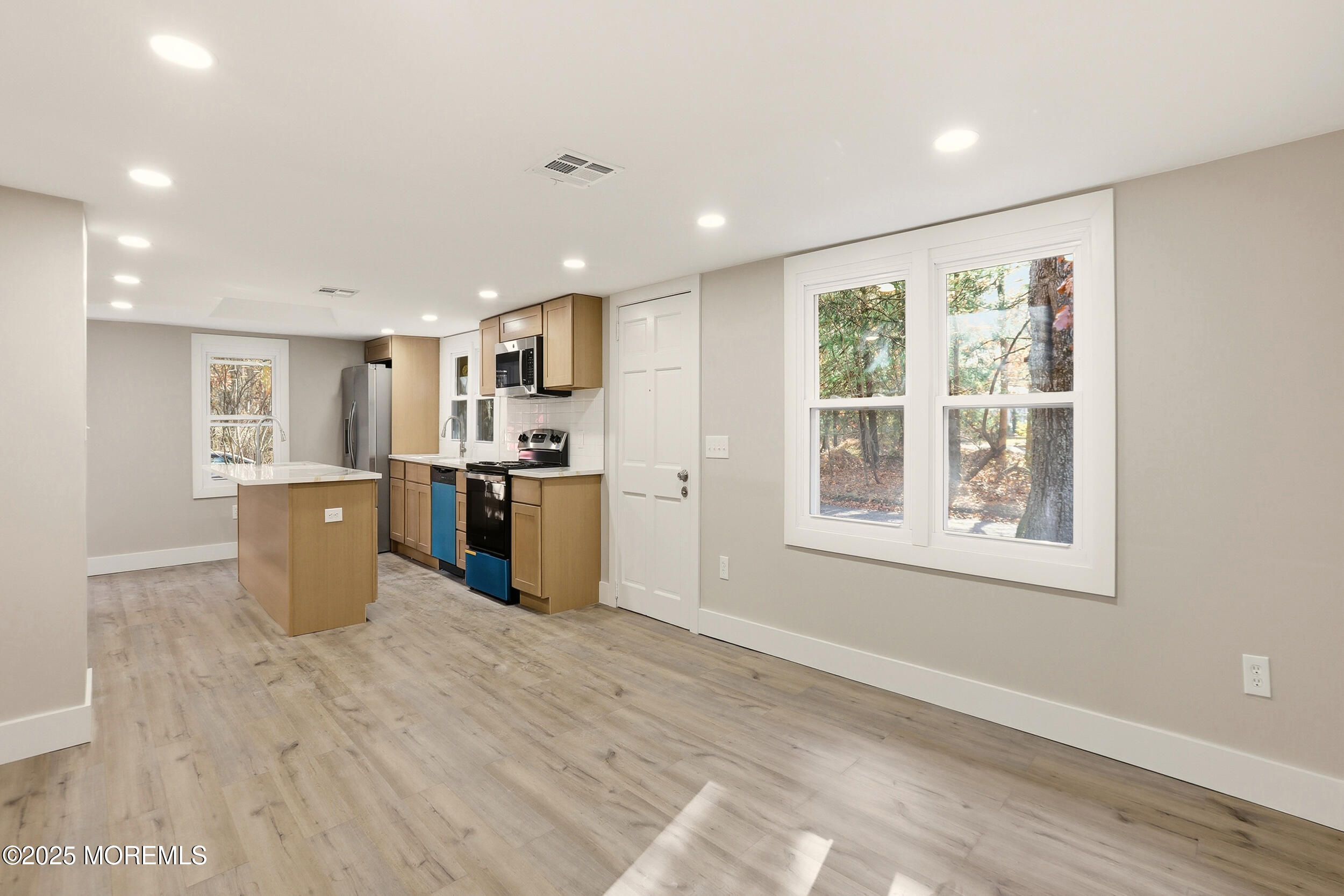 31 Rappleyea Court Howell, NJ 07731 - Photo 10 of 30 a kitchen with stainless steel appliances granite countertop a stove a sink and a refrigerator