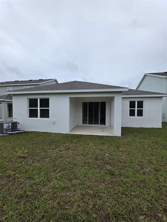 6008 Vision Road St. Cloud, FL 34771 - Photo 29 of 33 a house view with a garden space