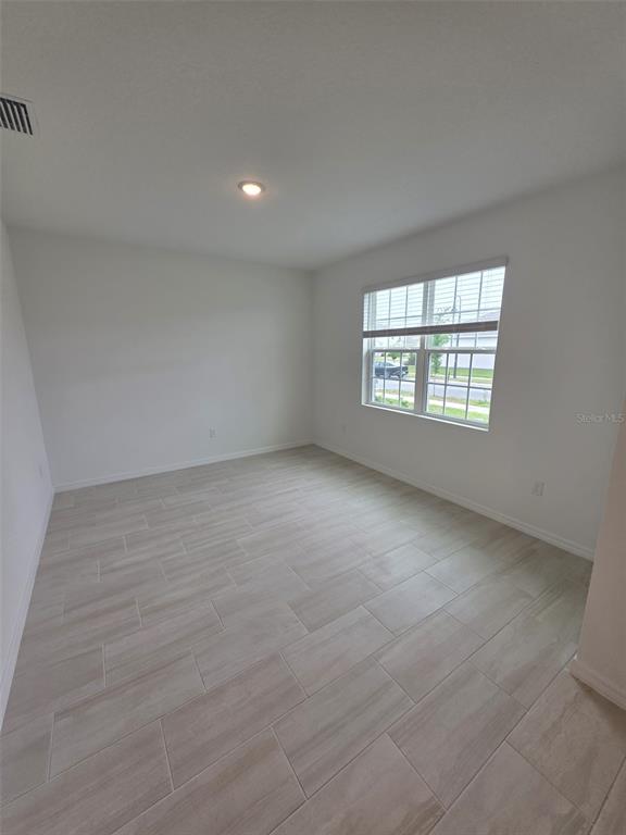 6008 Vision Road St. Cloud, FL 34771 - Photo 3 of 33 an empty room with a window