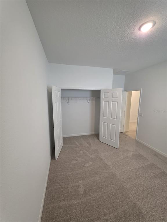 6008 Vision Road St. Cloud, FL 34771 - Photo 9 of 33 an empty room with a natural light