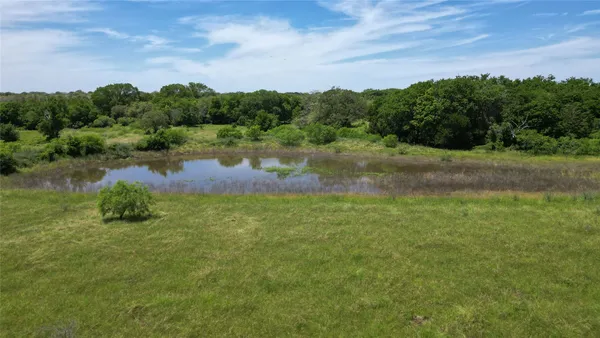 a view of a lake with a yard