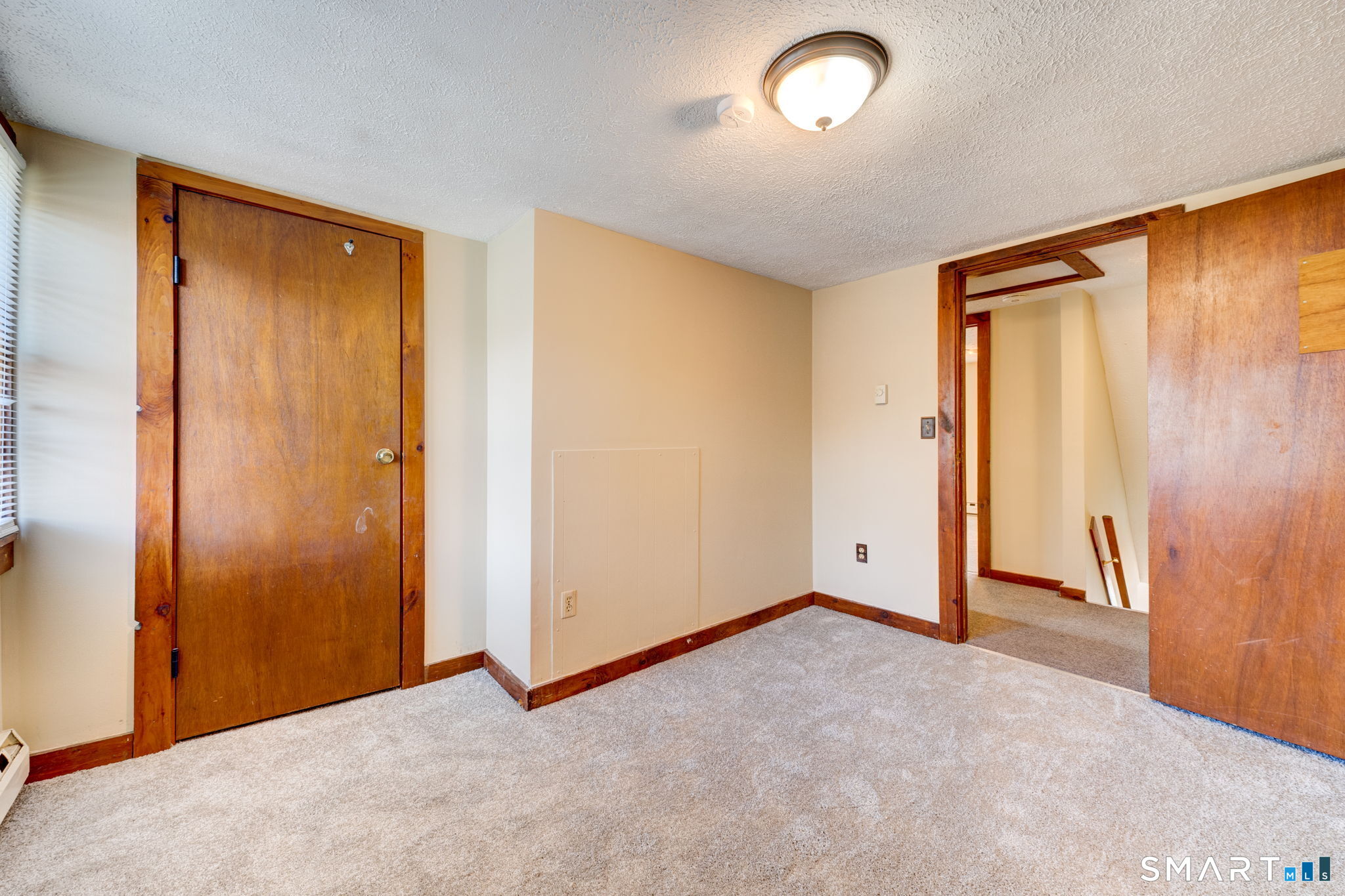 8 Maple Avenue Plymouth, CT 06782 - Photo 16 of 20 an empty room with closet and a chandelier fan
