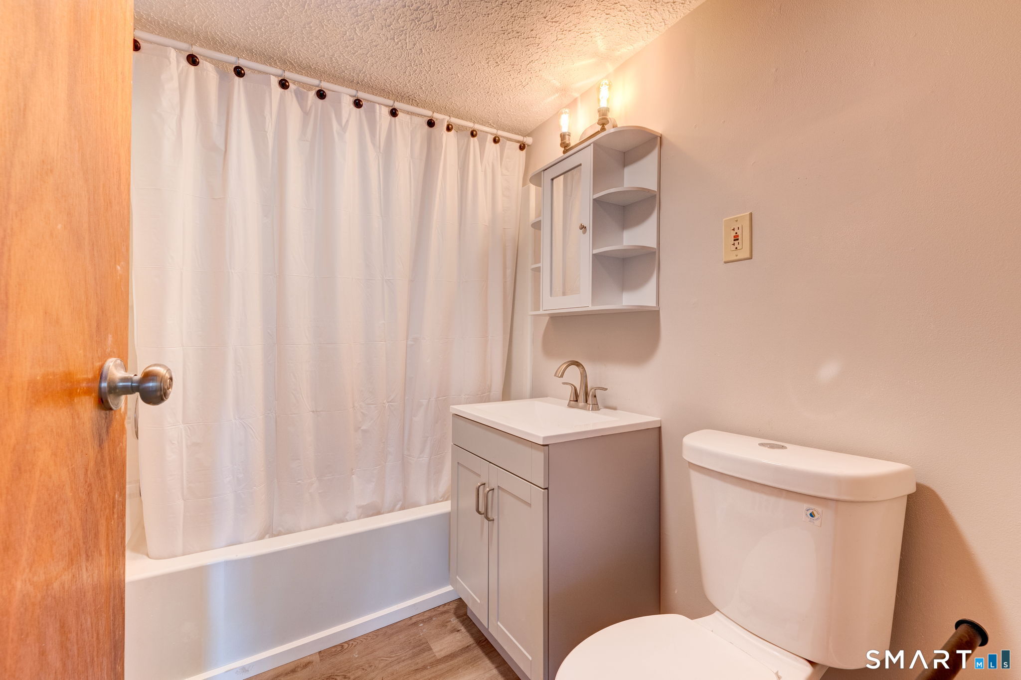 8 Maple Avenue Plymouth, CT 06782 - Photo 17 of 20 a bathroom with a sink a toilet and shower