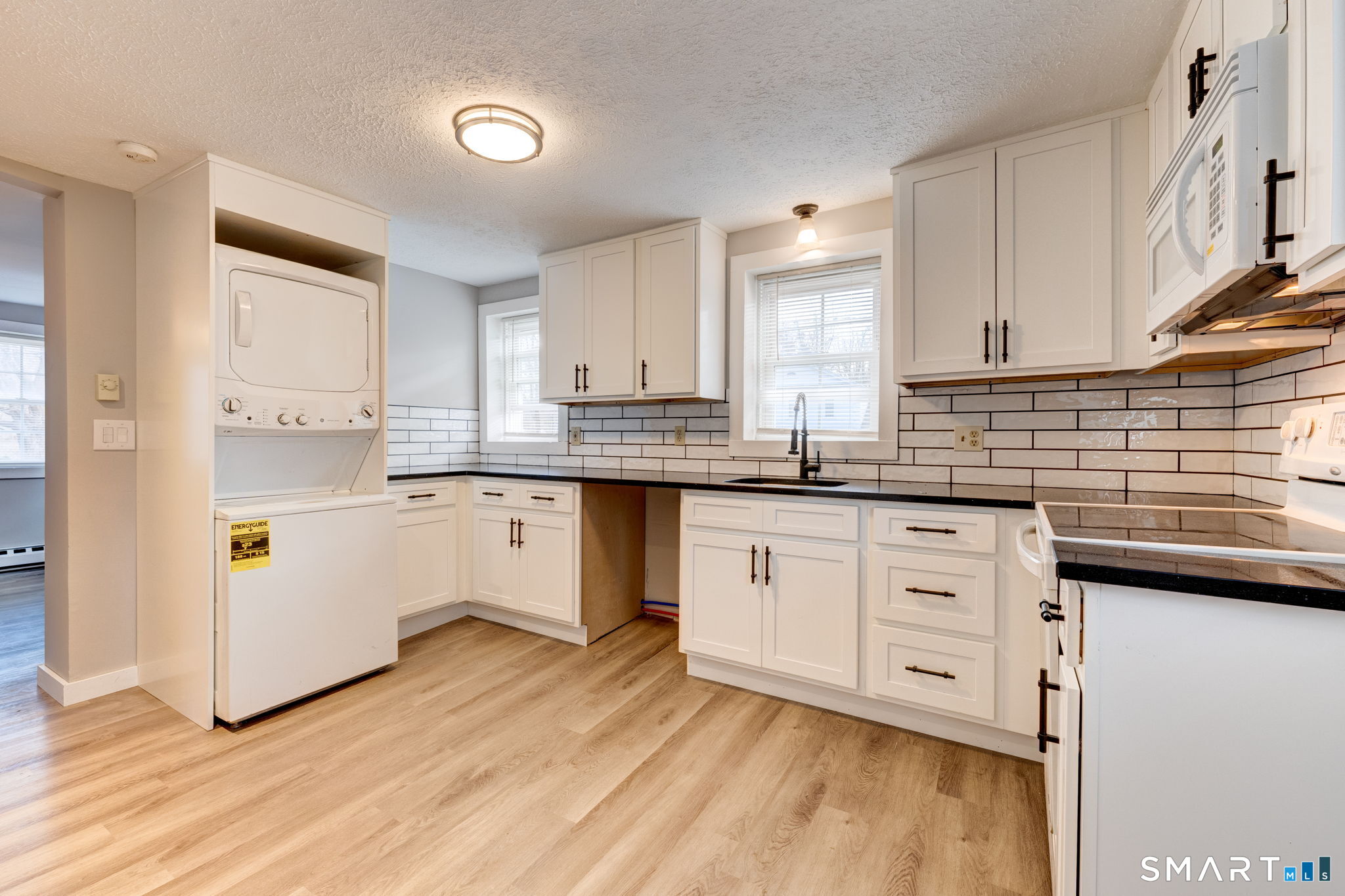 8 Maple Avenue Plymouth, CT 06782 - Photo 4 of 20 a kitchen with stainless steel appliances granite countertop a sink a stove and cabinets
