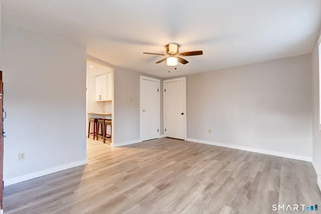 a view of an empty room with a window