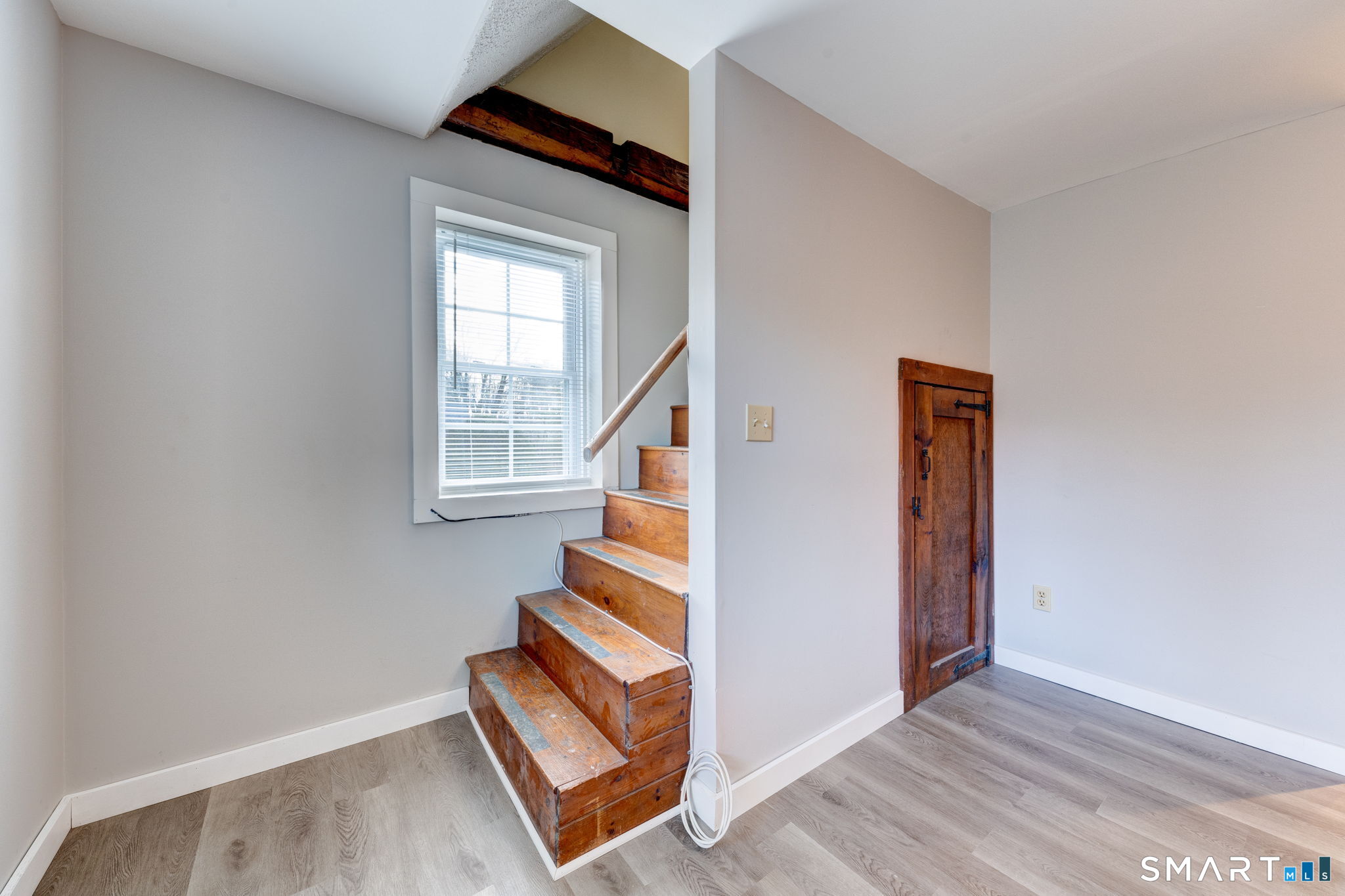 8 Maple Avenue Plymouth, CT 06782 - Photo 8 of 20 a view of an entryway with wooden floor and door
