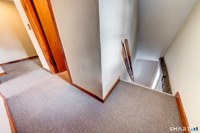 a view of a hallway with front door