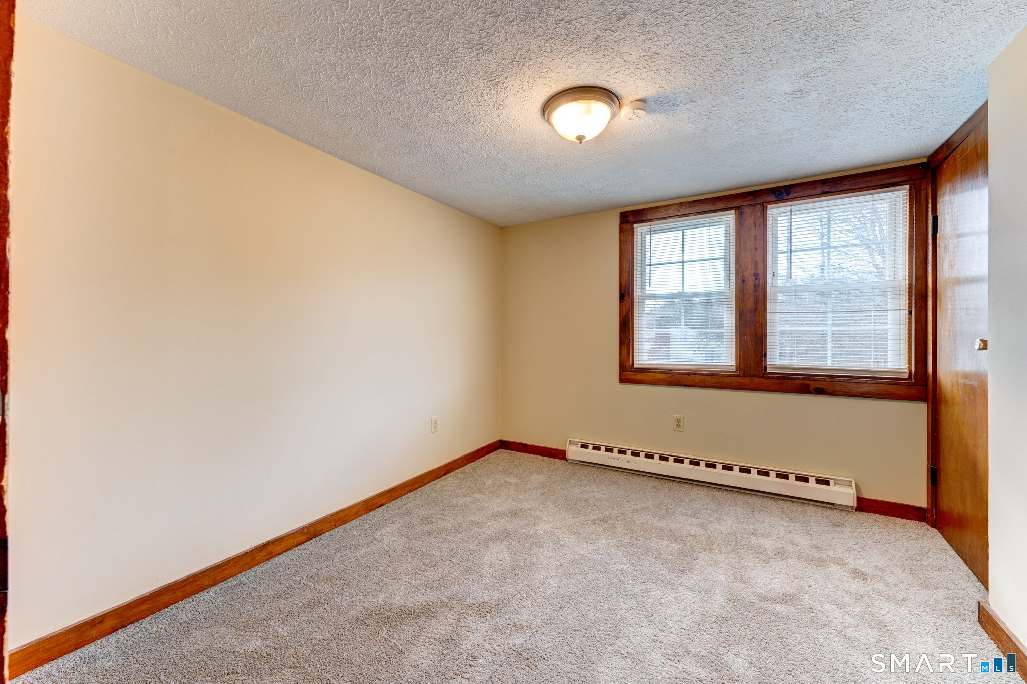 8 Maple Avenue Plymouth, CT 06782 - Photo 10 of 20 an empty room with a empty space and windows