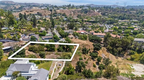 an aerial view of house with yard