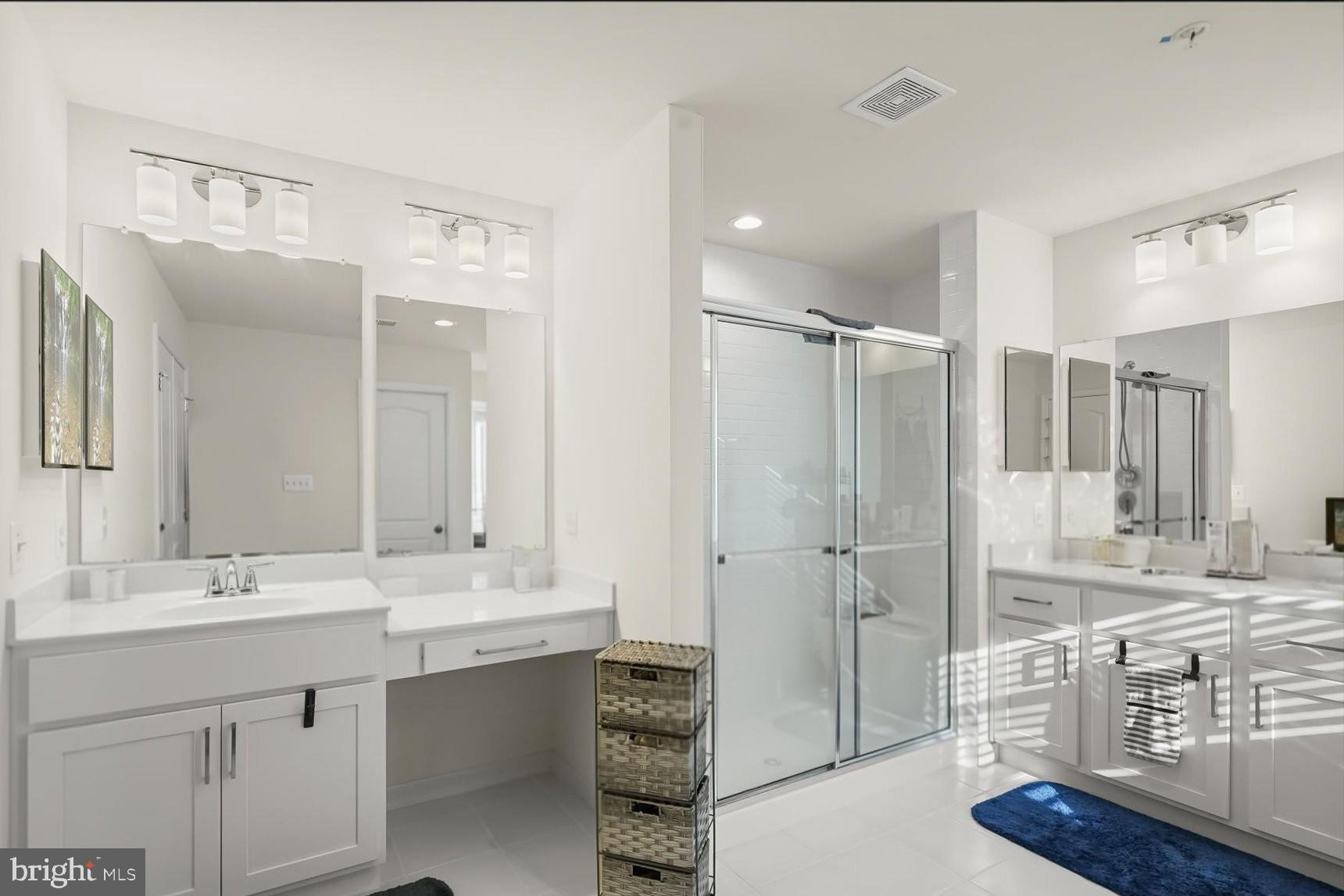 2102 St James Road Accokeek, MD 20607 - Photo 25 of 43 a bathroom with a double vanity sink mirror and shower