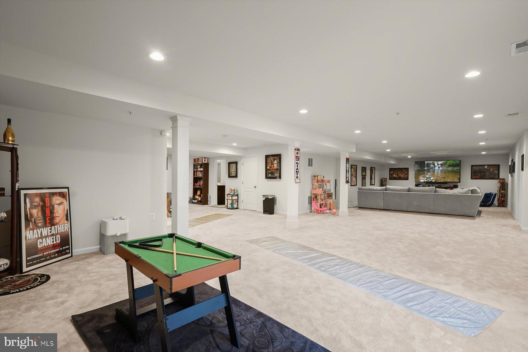 2102 St James Road Accokeek, MD 20607 - Photo 35 of 43 a living room with furniture and a table