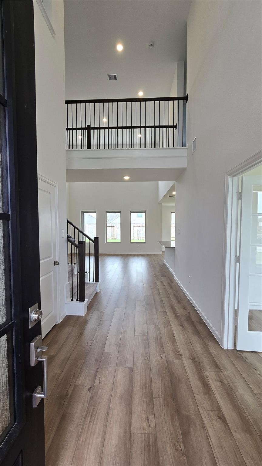 14971 Calluna Heather Lane Conroe, TX 77302 - Photo 3 of 22 a view of entryway with wooden floor