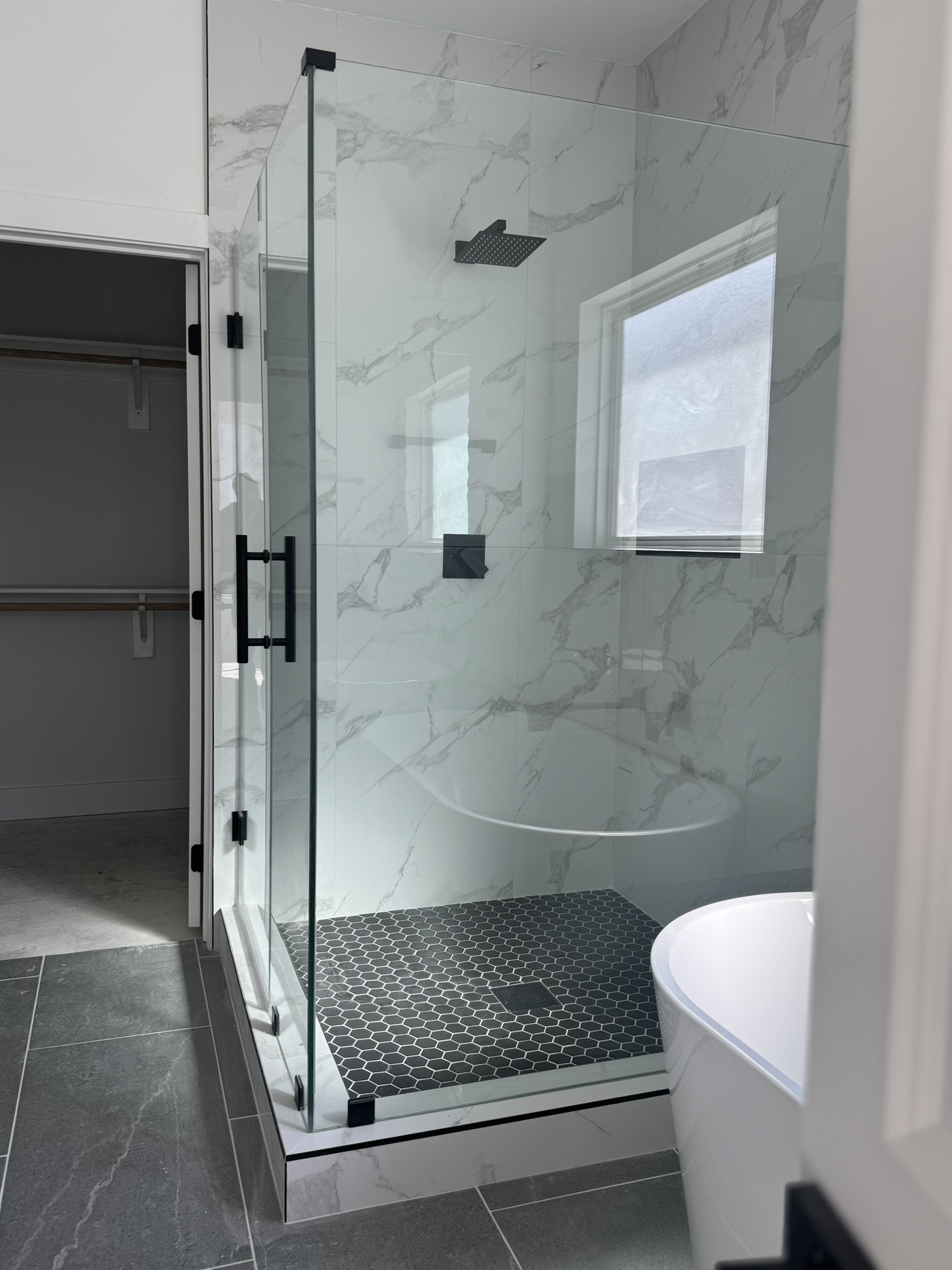 6543 Sealey Street Houston, TX 77091 - Photo 4 of 6 a bathroom with a shower and a toilet