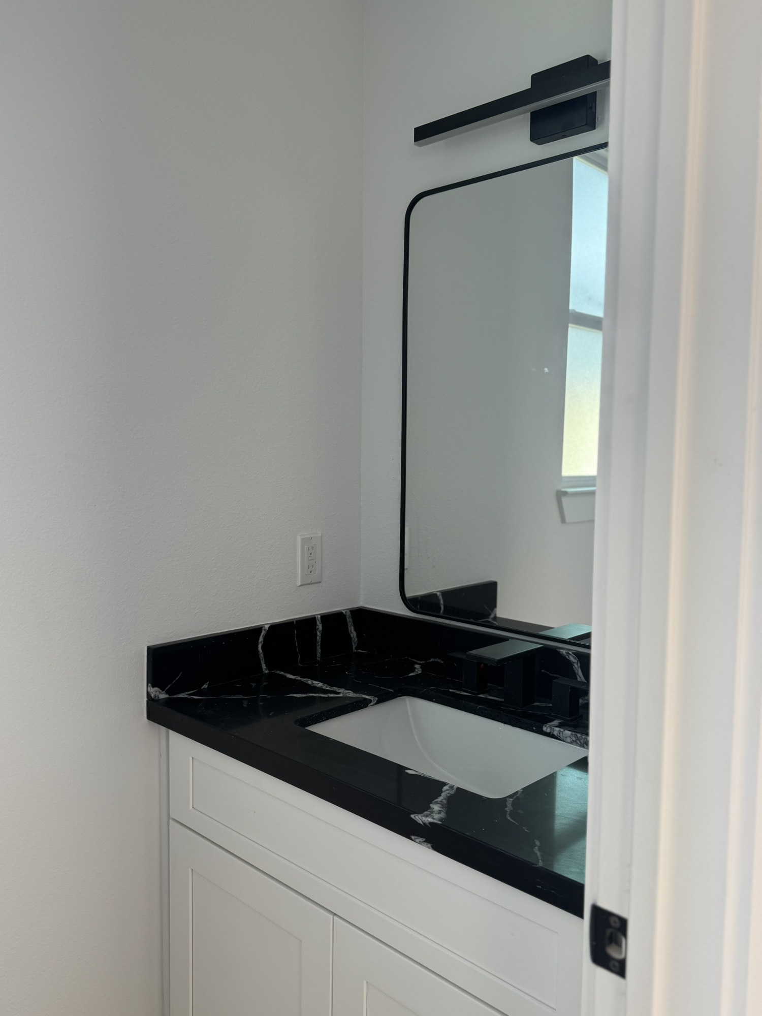 6543 Sealey Street Houston, TX 77091 - Photo 5 of 6 a close view of a sink and dishwasher with kitchen island