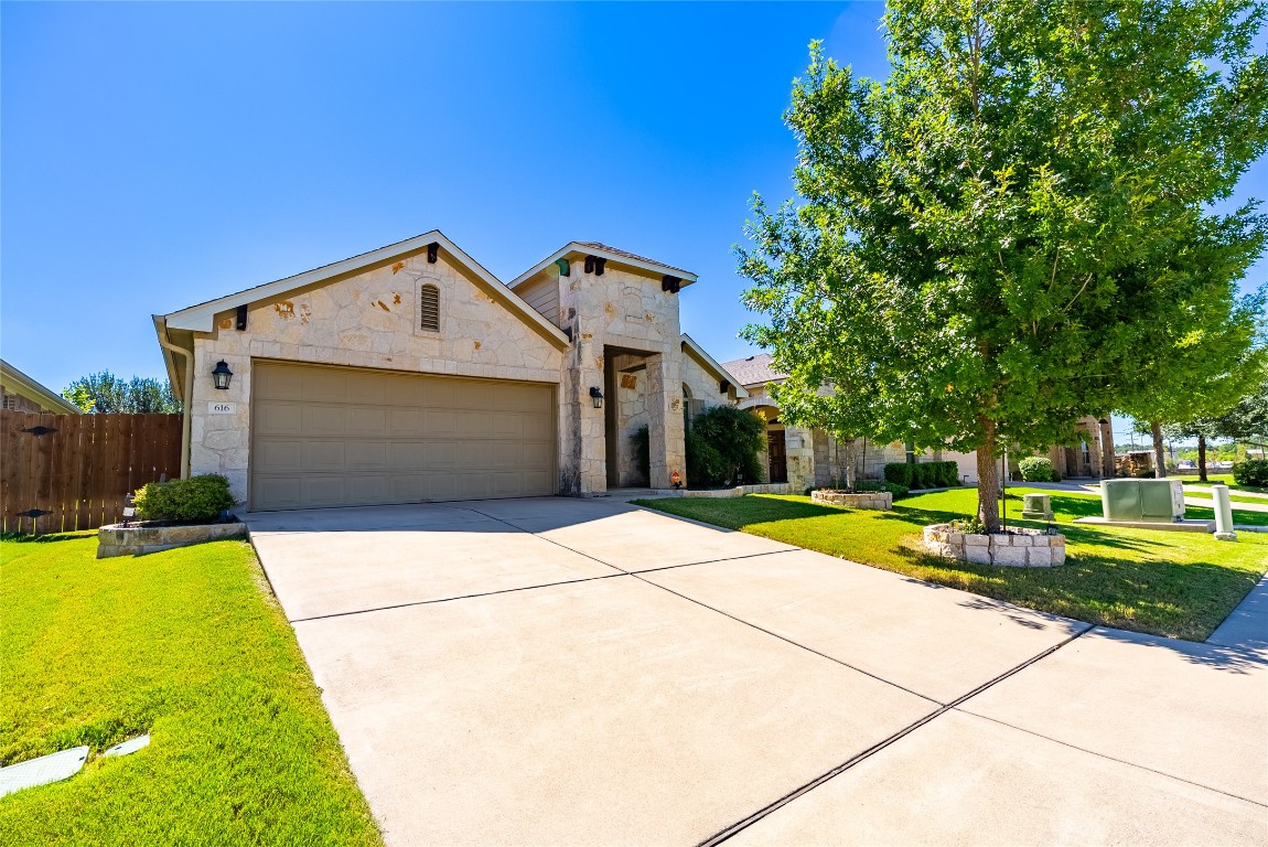 a front view of a house with yard