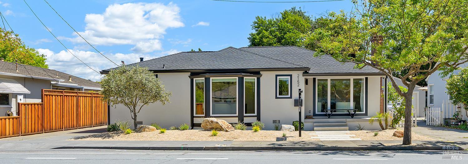 a front view of a house with garden