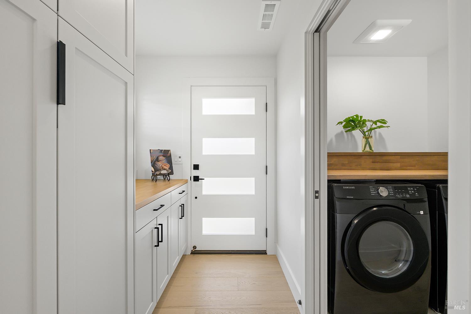 2152 Montecito Avenue Santa Rosa, CA 95404 - Photo 11 of 47 a bathroom with a sink a washer and dryer
