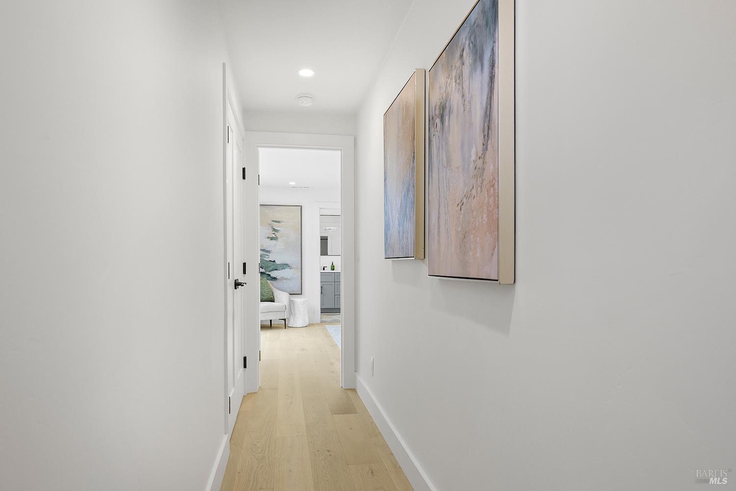 2152 Montecito Avenue Santa Rosa, CA 95404 - Photo 24 of 47 a view of a hallway with wooden floor and a bathroom