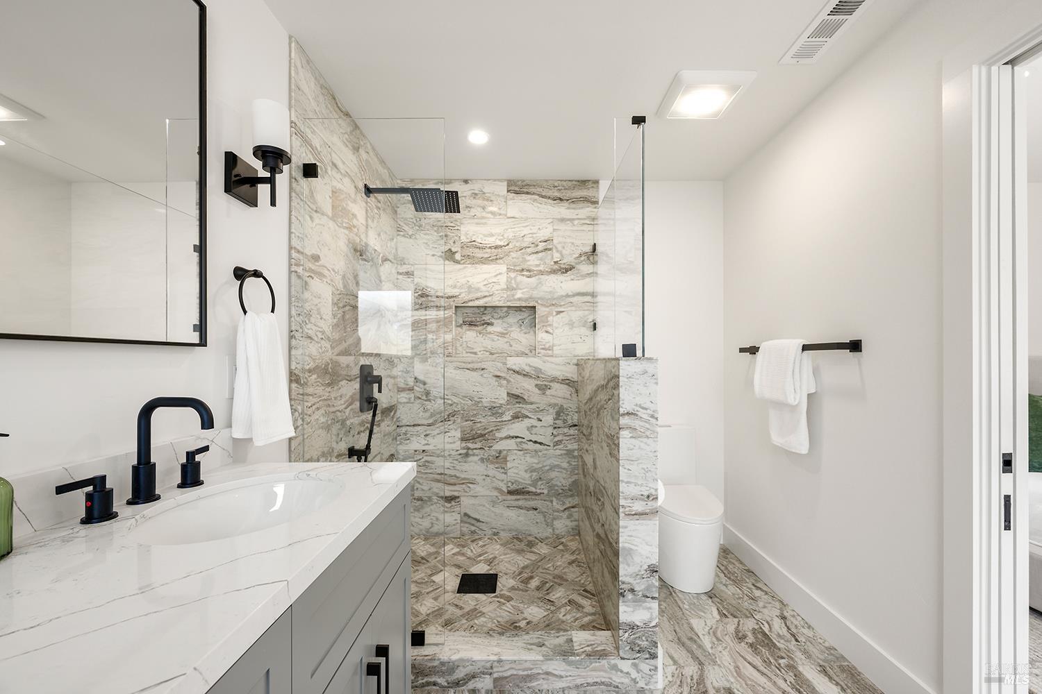 2152 Montecito Avenue Santa Rosa, CA 95404 - Photo 29 of 47 a bathroom with a double vanity sink a toilet and shower