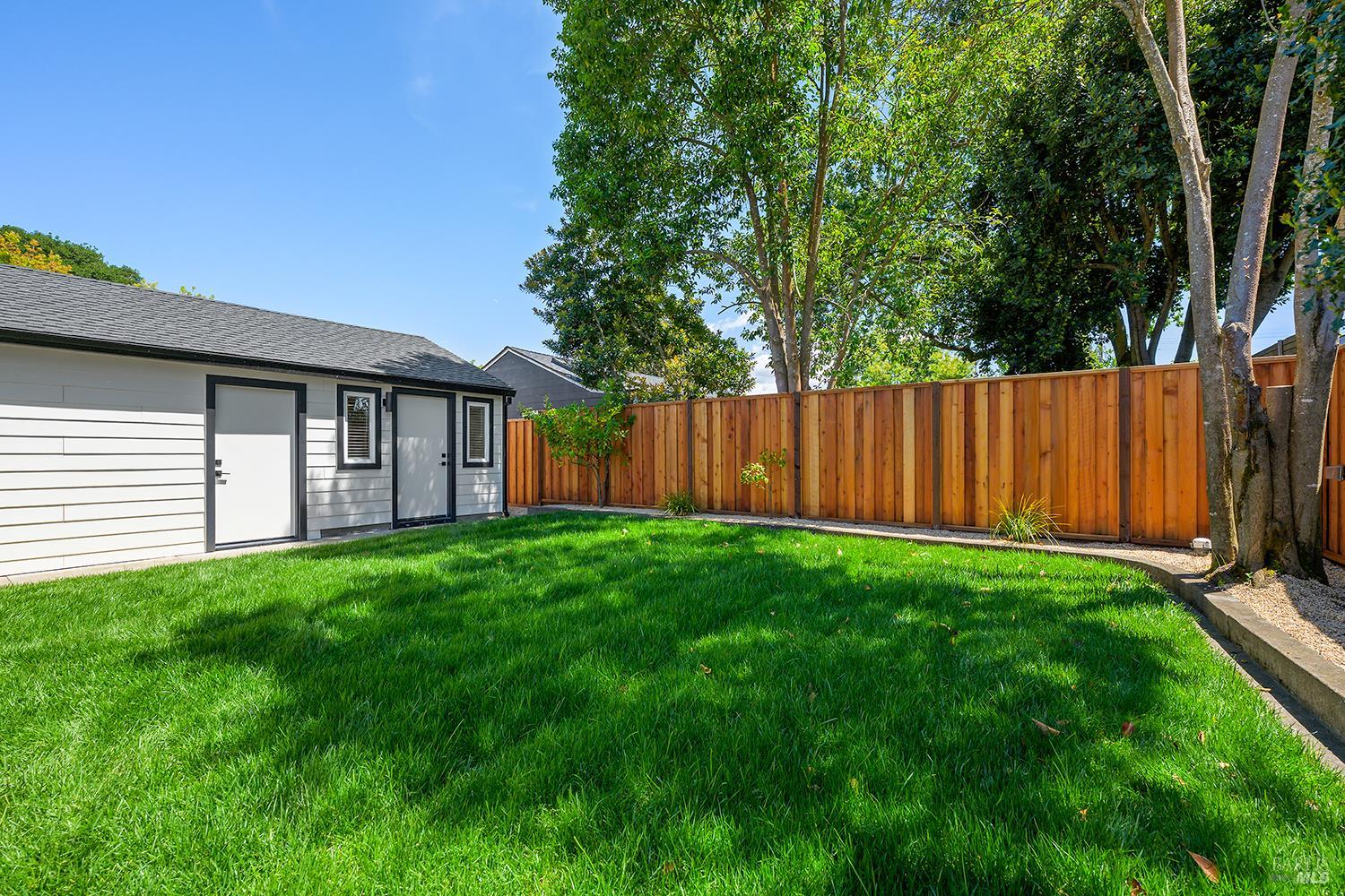 2152 Montecito Avenue Santa Rosa, CA 95404 - Photo 38 of 47 a view of a backyard with plants and large tree
