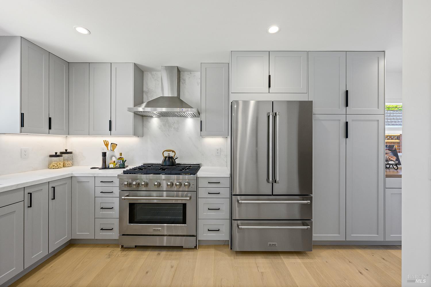 2152 Montecito Avenue Santa Rosa, CA 95404 - Photo 10 of 47 a kitchen with stainless steel appliances a stove and a refrigerator
