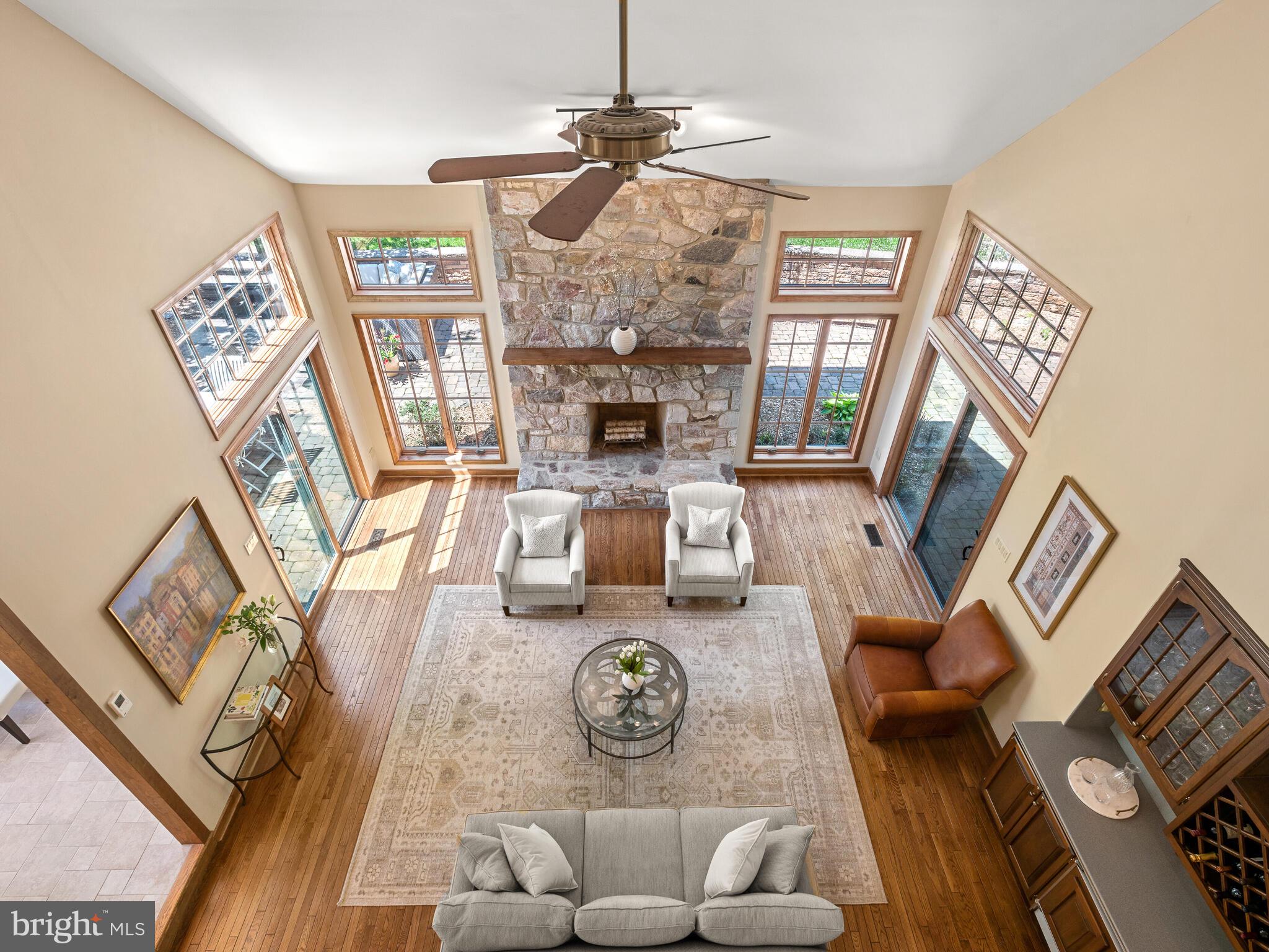 673 Thomas Jefferson Road Wayne, PA 19087 - Photo 11 of 64 a living room with furniture a fireplace and a chandelier