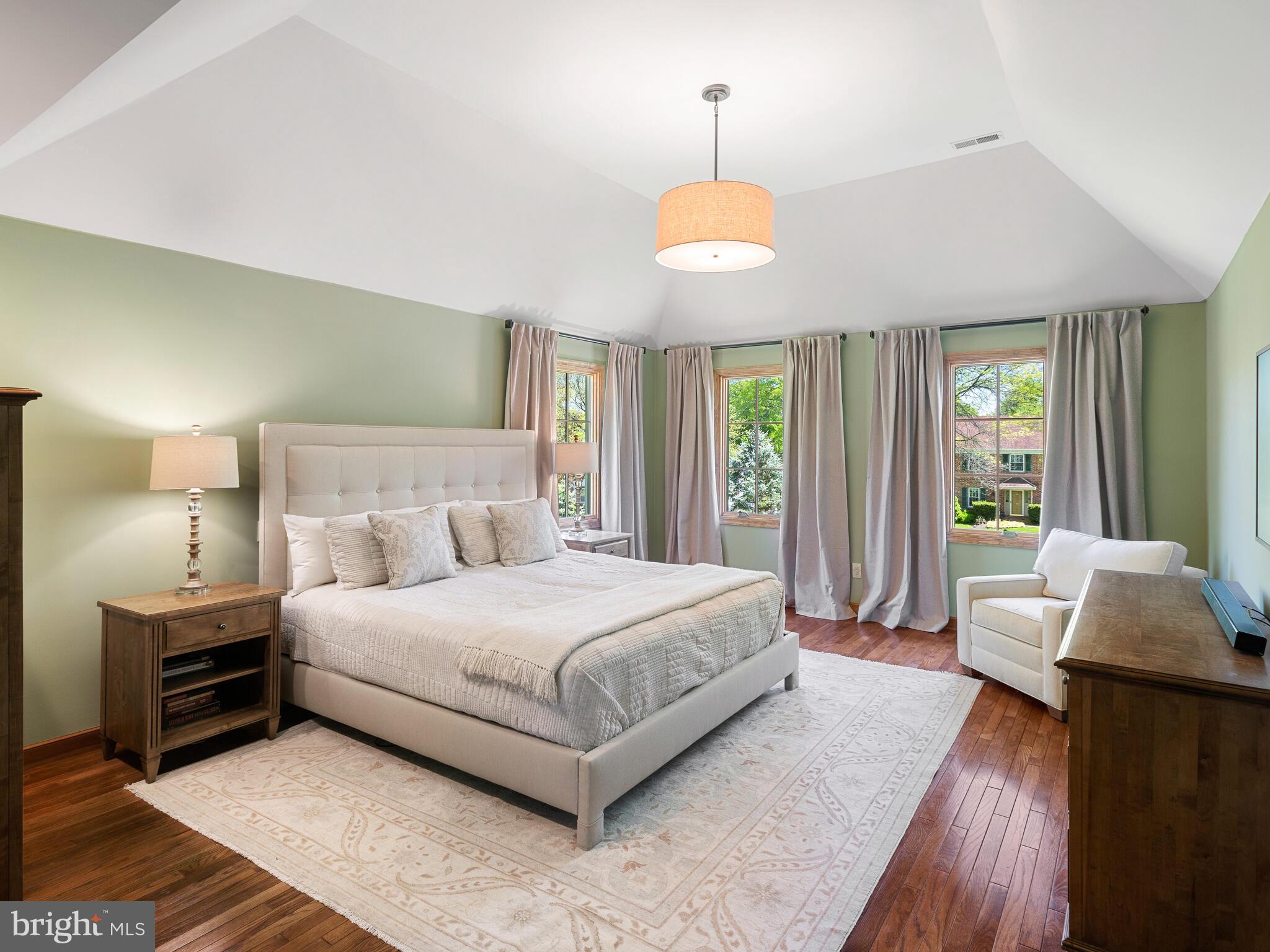 673 Thomas Jefferson Road Wayne, PA 19087 - Photo 29 of 64 a spacious bedroom with a bed and a chandelier