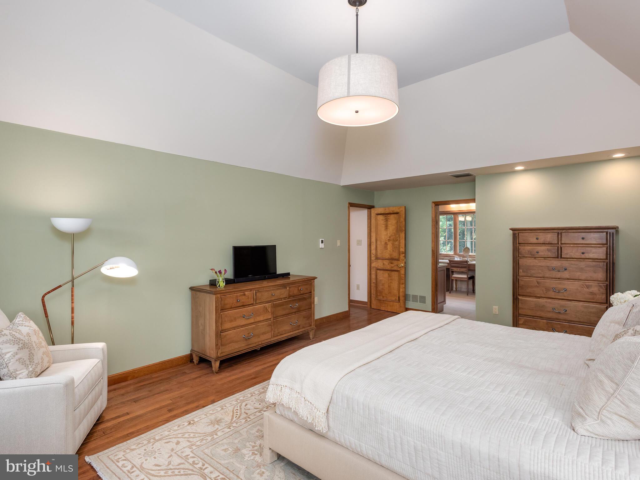 673 Thomas Jefferson Road Wayne, PA 19087 - Photo 30 of 64 a spacious bedroom with a bed and a couch