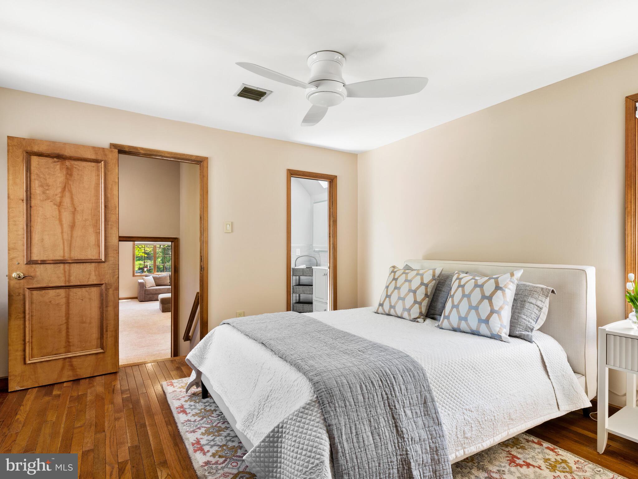 673 Thomas Jefferson Road Wayne, PA 19087 - Photo 39 of 64 a bedroom with a bed and a large mirror on the dresser