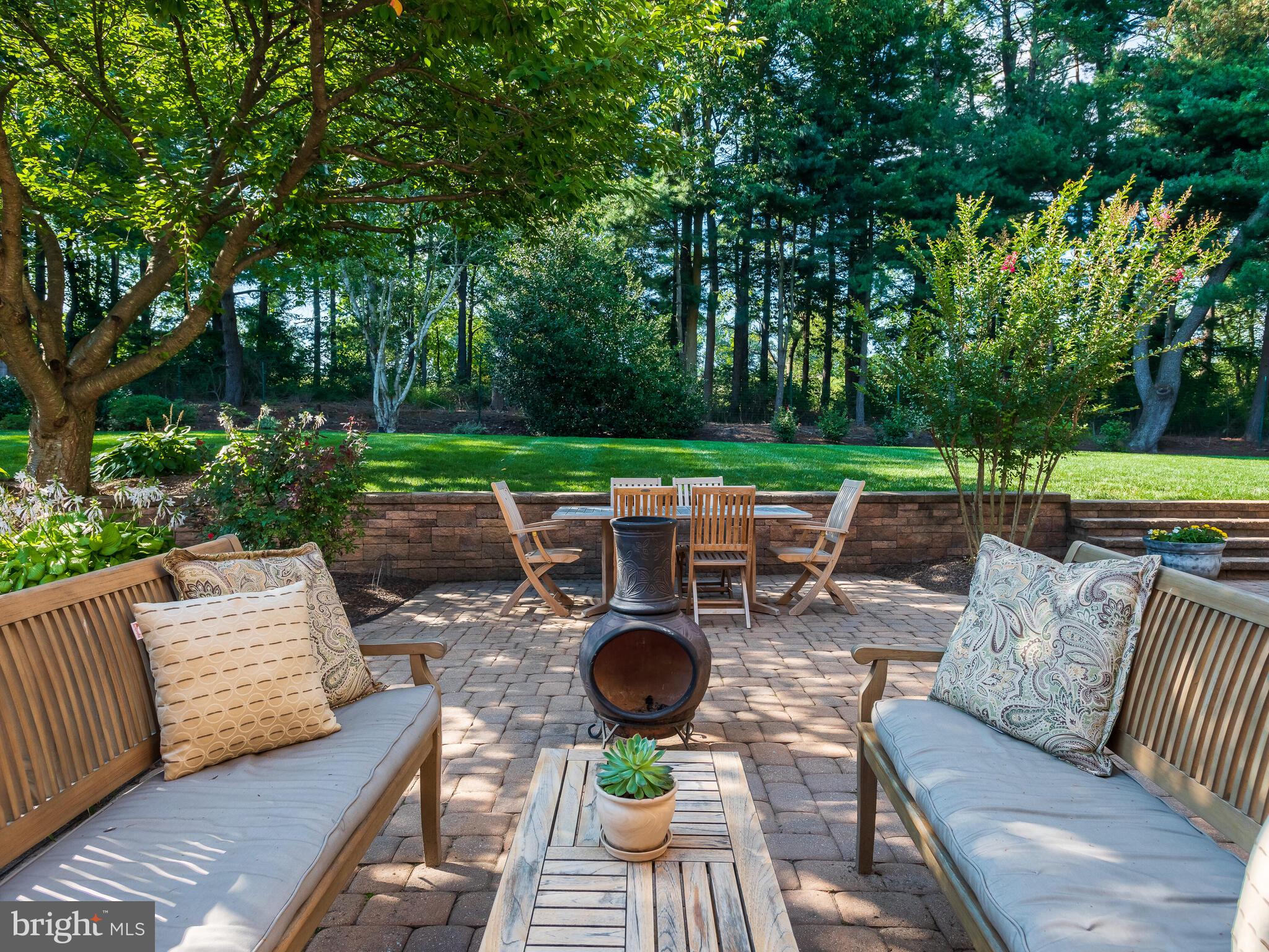 673 Thomas Jefferson Road Wayne, PA 19087 - Photo 51 of 64 a view of a patio with couches chairs and a fire pit
