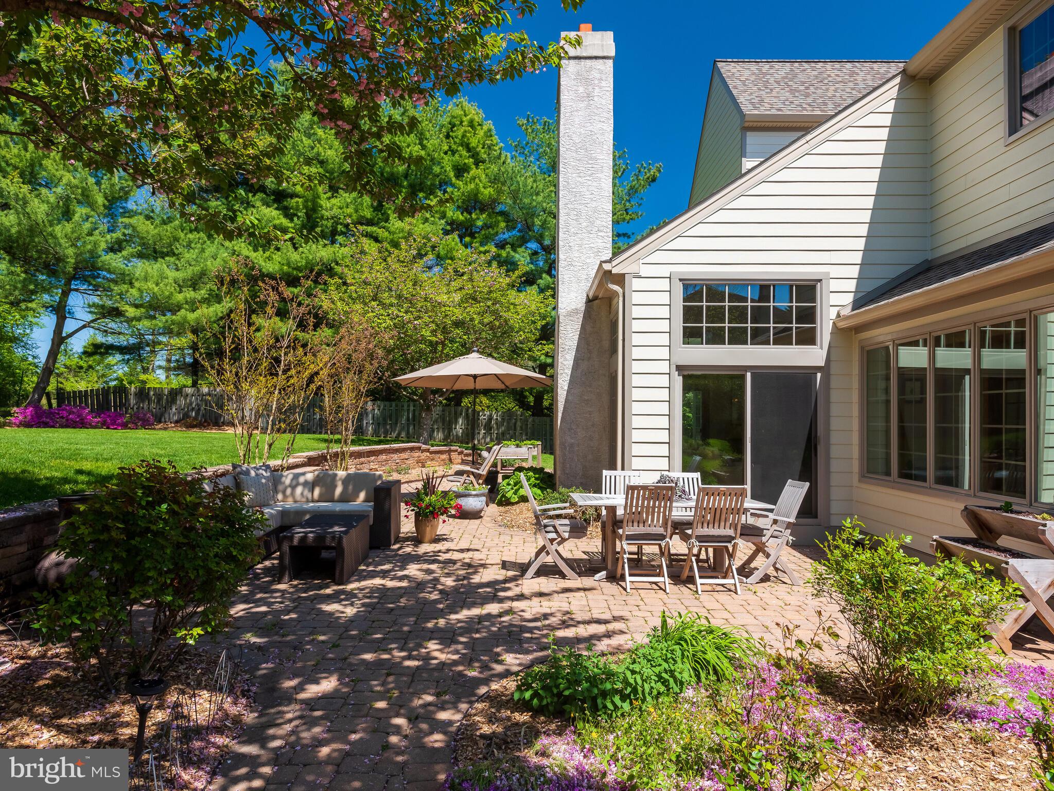 673 Thomas Jefferson Road Wayne, PA 19087 - Photo 52 of 64 a view of a house with backyard sitting area and swimming pool