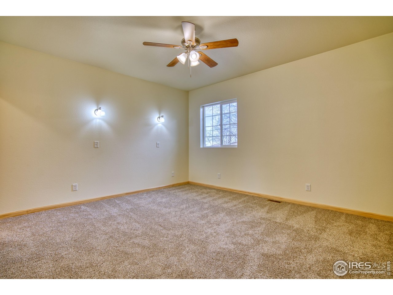 126 2nd Street Mead, CO 80542 - Photo 12 of 22 a view of an empty room and chandelier fan