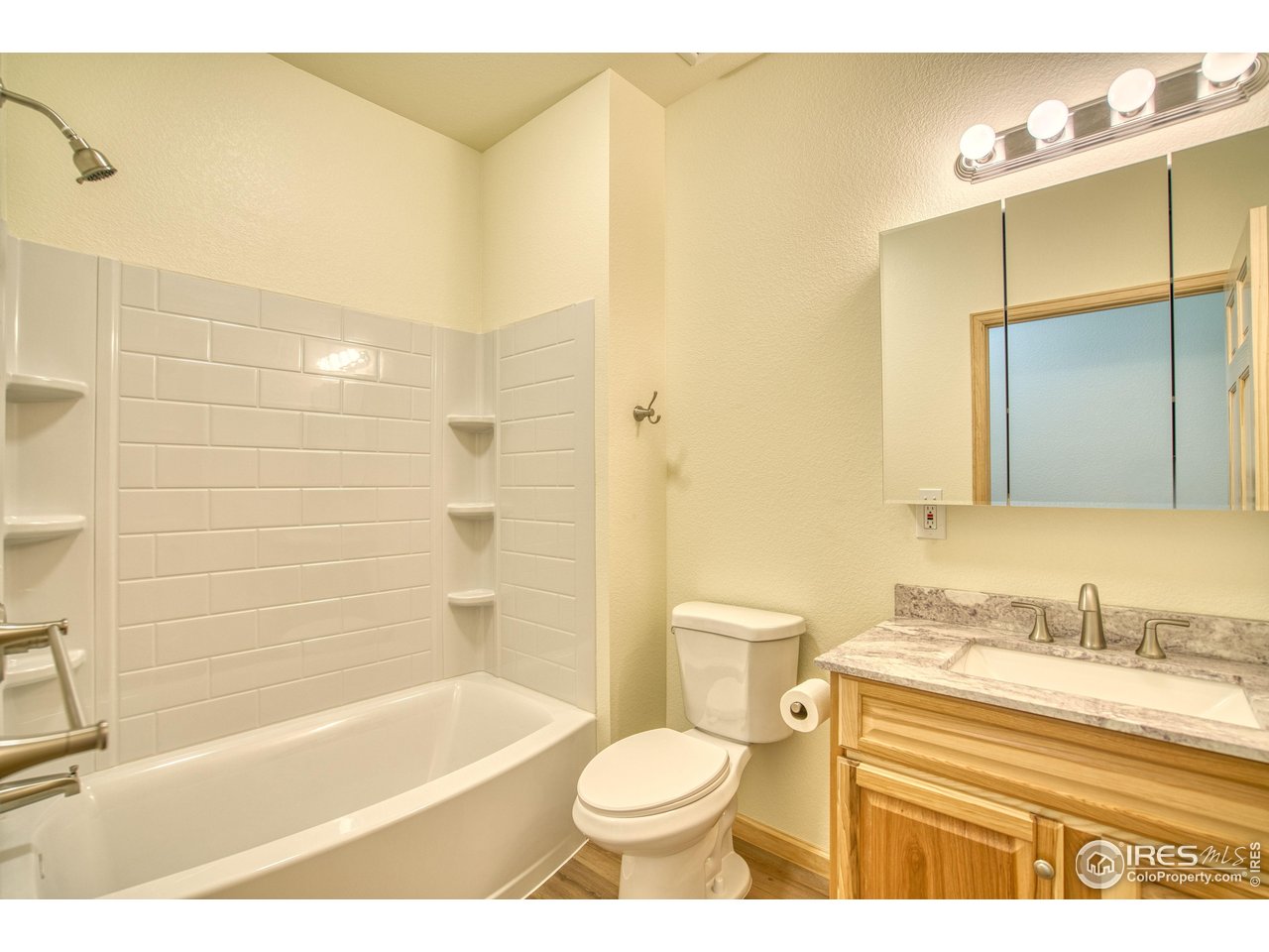 126 2nd Street Mead, CO 80542 - Photo 13 of 22 a bathroom with a sink a toilet and shower